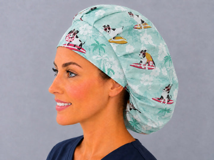 Back view of the dog surfers bouffant scrub cap — surfing dogs, surfboards and palms across the full mint aqua crown