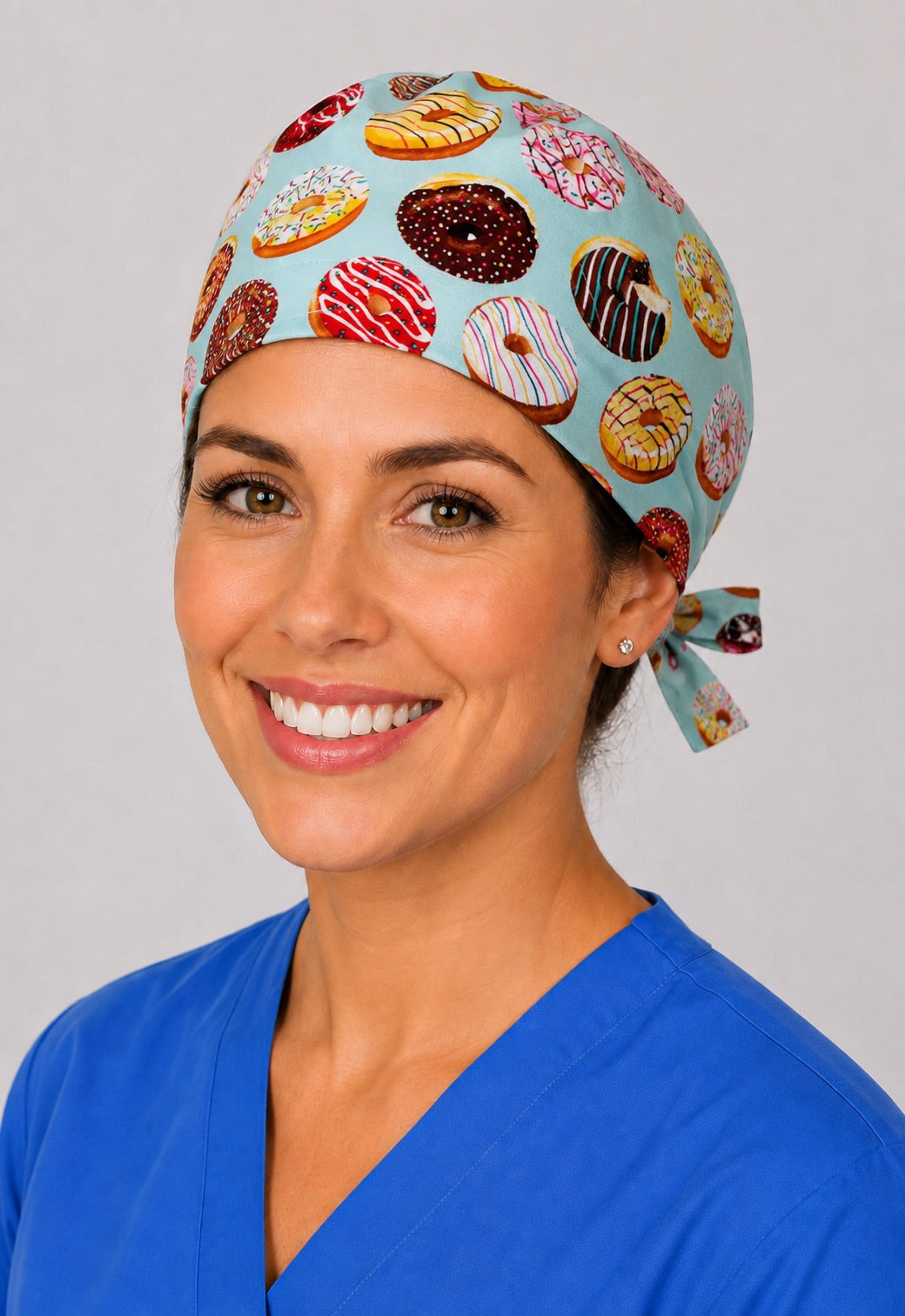 Three-quarter view of donut print unisex bakery and dessert adjustable surgical hat for nurses, dentists and vet techs