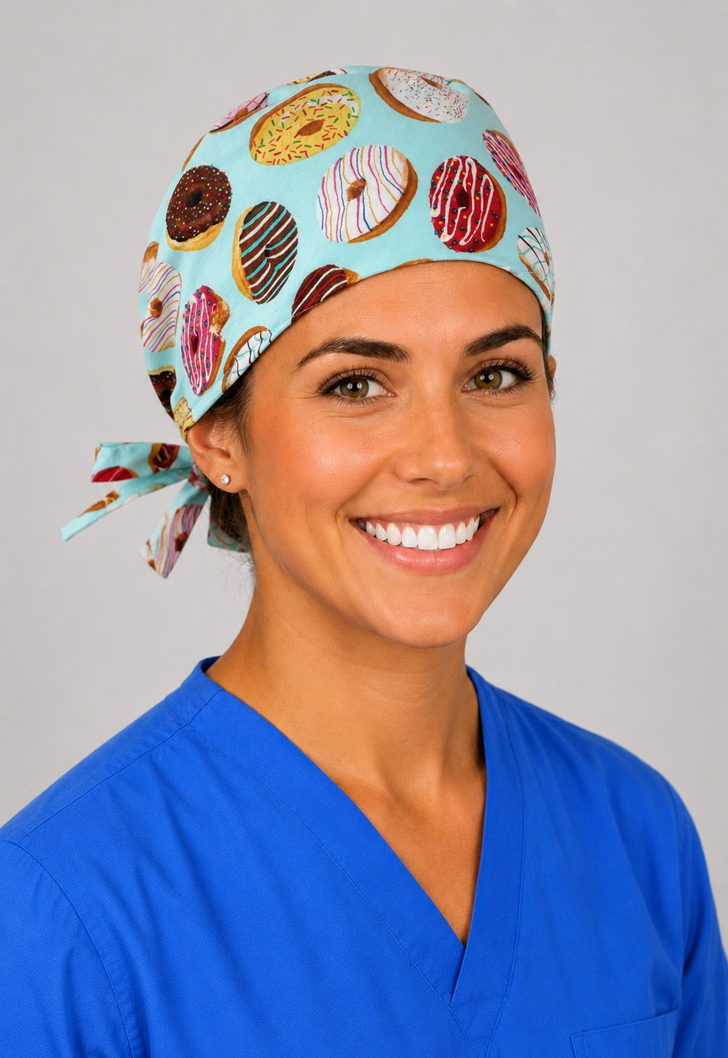 Back view of adjustable tie-back knot on mint donut print unisex surgical hat
