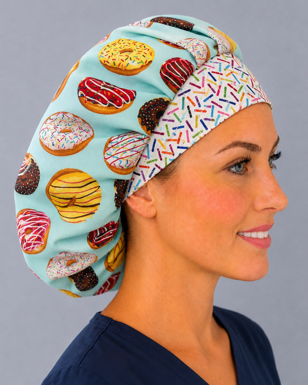 Donut and sprinkles bouffant scrub cap side profile — roomy cap that secures long thick hair, sweet treat print for baker and nurse gifts