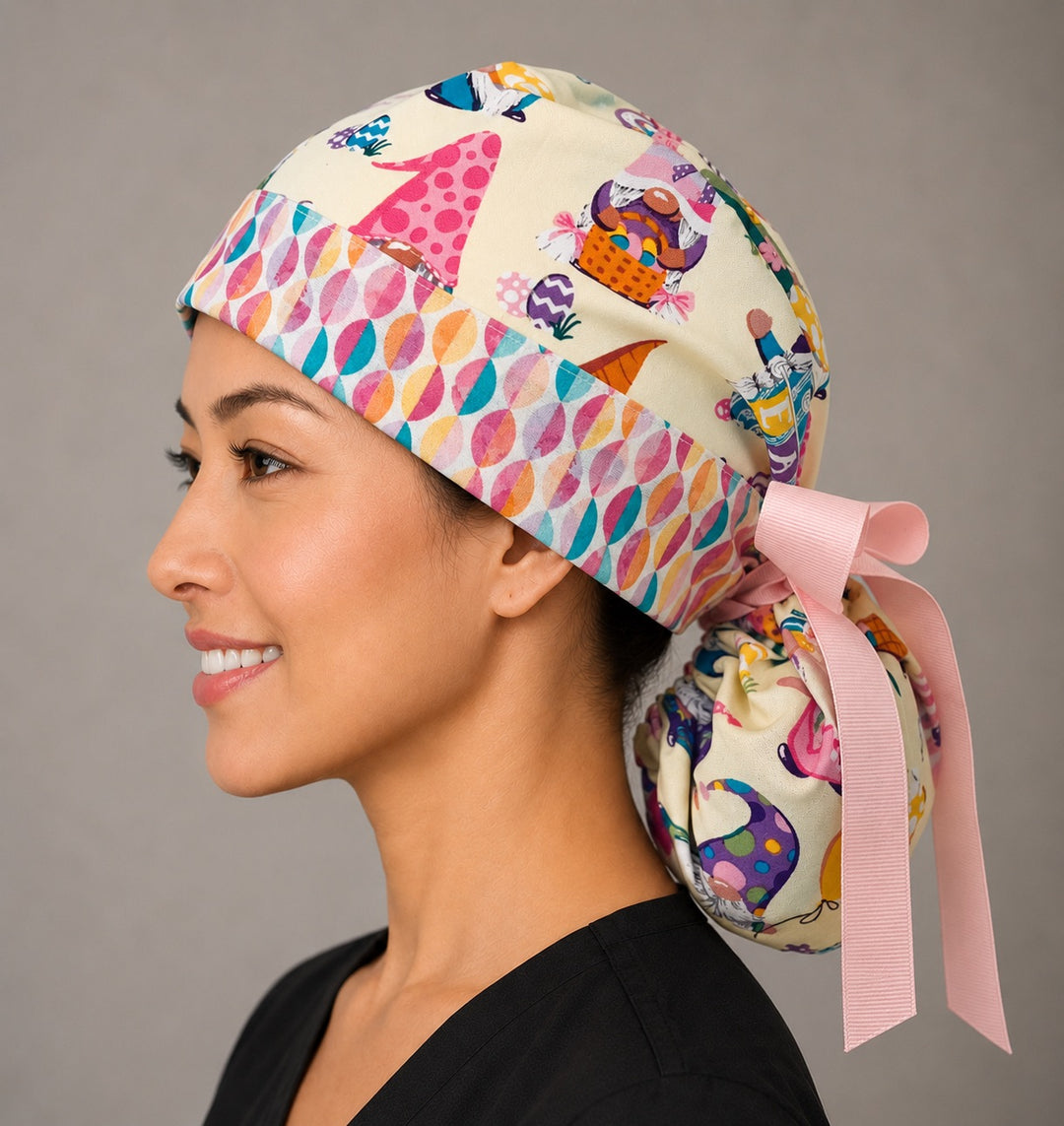 Easter gnomes ponytail surgical cap left side profile showing gathered ponytail pouch of pastel gnomes and Easter eggs with pink ribbon tie