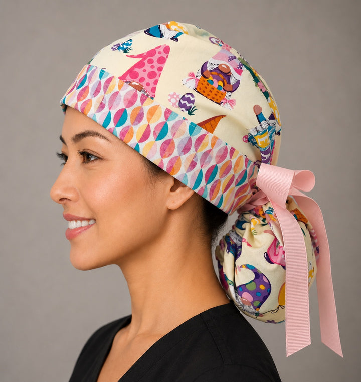 Easter gnomes ponytail surgical cap left side profile showing gathered ponytail pouch of pastel gnomes and Easter eggs with pink ribbon tie