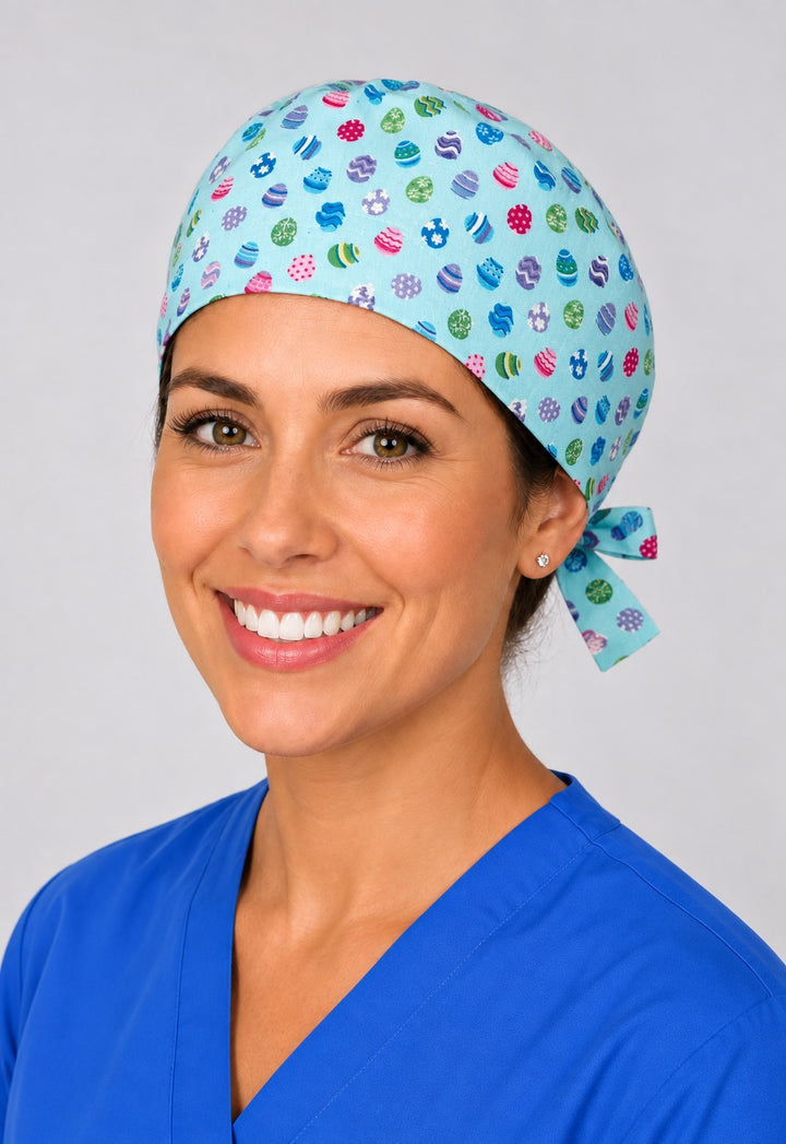 Nurse wearing Easter mini egg tie back scrub cap, aqua blue spring surgical hat with side tie by OR World