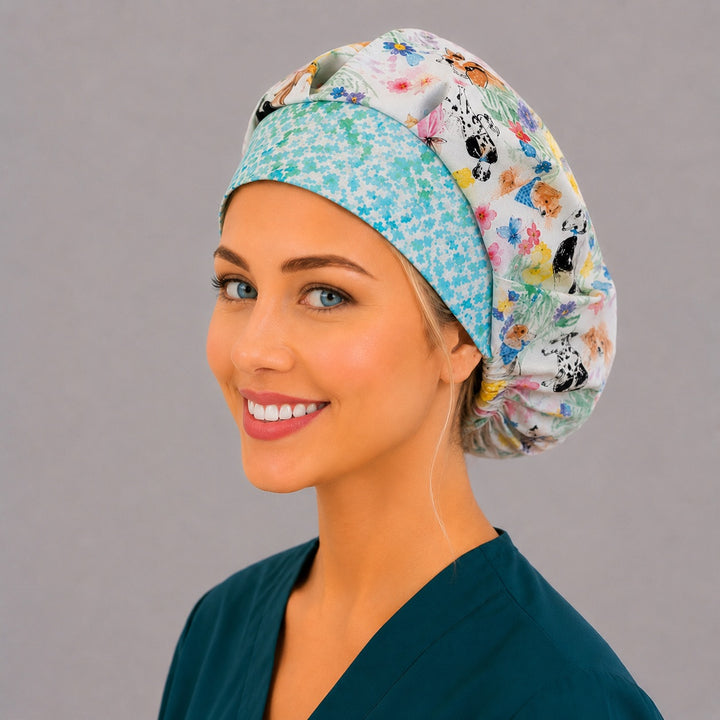 Woman wearing an Easter Pups and Petals bouffant scrub cap, front view — watercolor puppies with bunny ears and spring florals with aqua band, adjustable women&