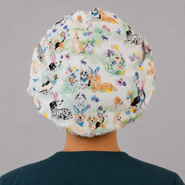 Back view of the Easter Pups and Petals bouffant scrub cap — full roomy fit showing watercolor puppies, bunnies, eggs and spring florals