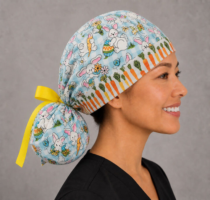 Easter rabbits and carrots ponytail surgical cap left side profile showing gathered ponytail pouch of bunnies and eggs on aqua gingham with yellow ribbon tie