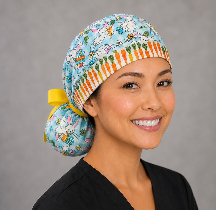 Easter rabbits and carrots ponytail nurse cap right three-quarter angle on smiling model showing bunnies, eggs, carrots and carrot band with yellow ribbon bow