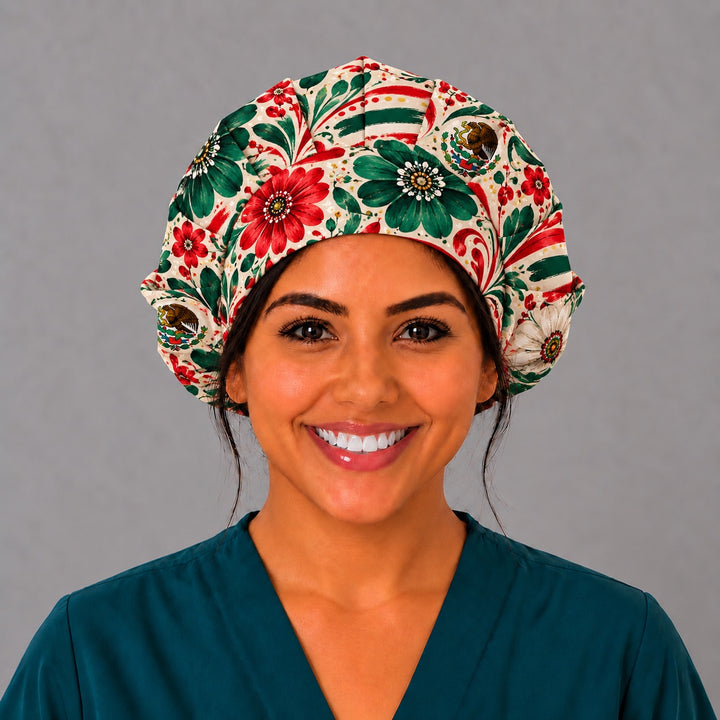 Nurse wearing a bouffant surgical hat with the Mexican escudo eagle, front view, painted red and green flowers on cream