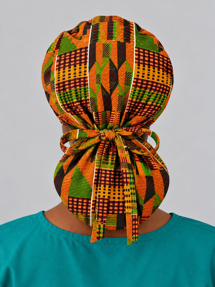 Back view of an extra-large Kente ponytail surgical cap, showing full rear coverage, the gathered crown and long ties hanging down the center
