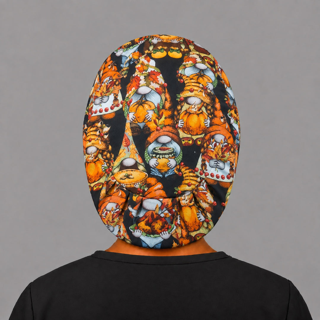 Full back view of the fall gnome Euro scrub cap — flat lay showing pumpkin gnomes and autumn leaves on black