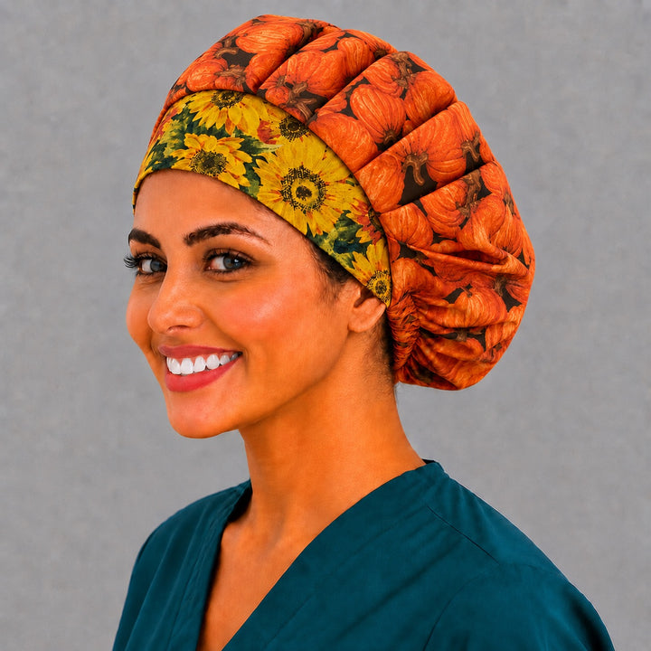 Fall harvest bouffant surgical cap for long hair, side view — pumpkin print with sunflower band, breathable cotton for vet techs and surgical teams