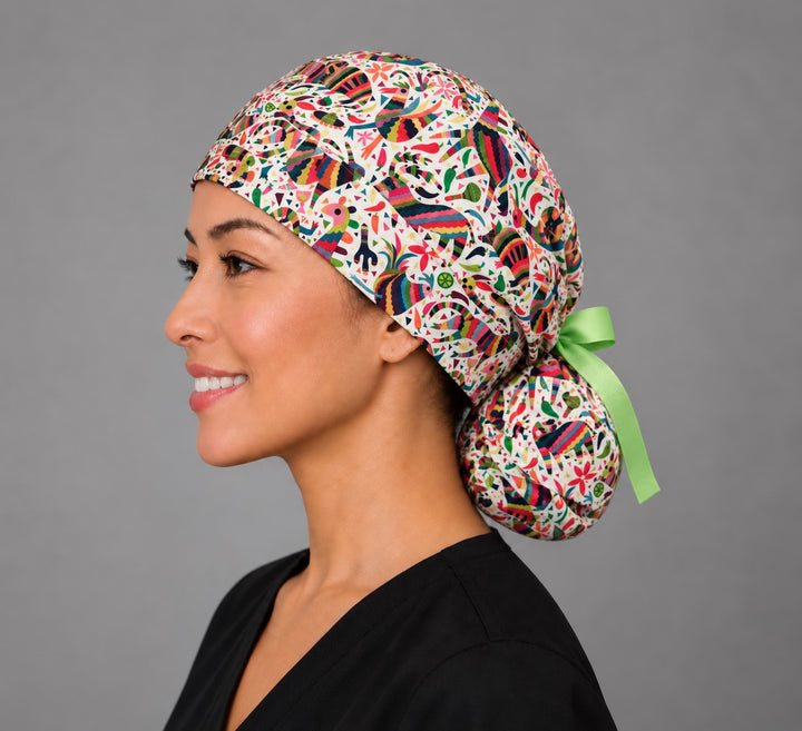 Fiesta piñata ponytail cap, left side profile — lime ribbon tie-back, handmade Mexican fiesta surgical cap, USA made