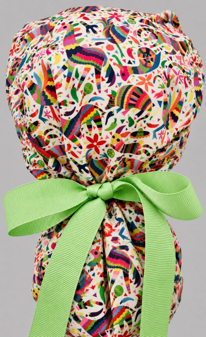 Back view of the fiesta piñata ponytail scrub cap — lime green grosgrain bow tied over the ponytail pouch