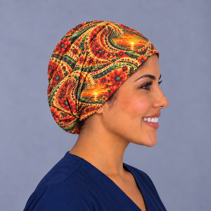 Right side profile of the fiesta sunset wave Euro surgical hat — emerald and gold paisley waves, breathable cotton cap
