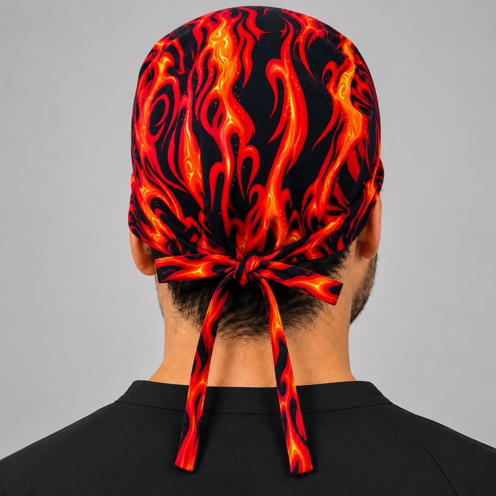 Back view of adjustable tie-back knot on orange and black flame fire scrub cap surgical hat
