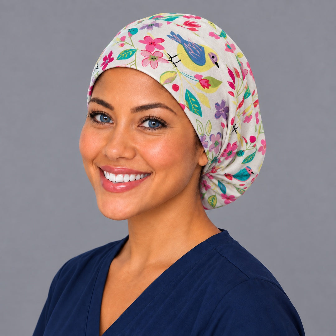 Floral songbird Euro surgical cap, left angled view — elastic adjustable back that secures long or thick hair