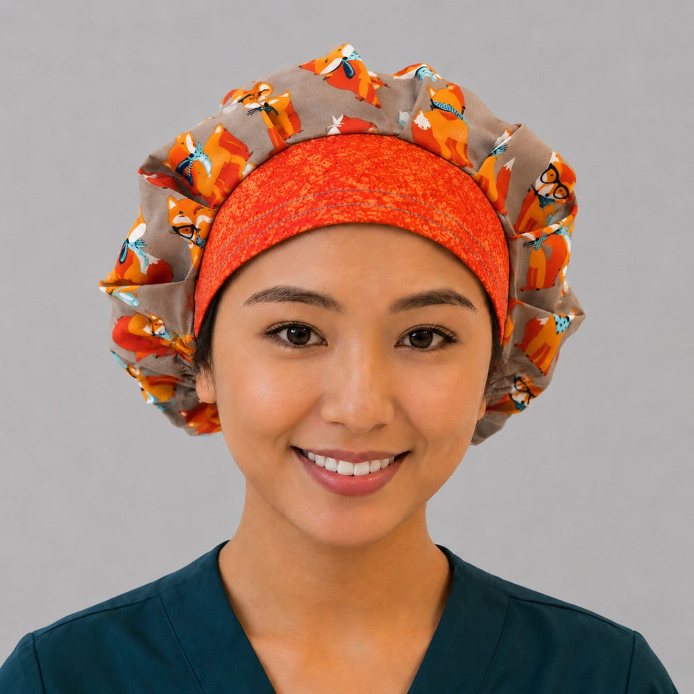 Woman wearing Foxy Foxes bouffant scrub cap, front view, gray hipster fox print surgical hat for OR nurses and vet techs, OR World