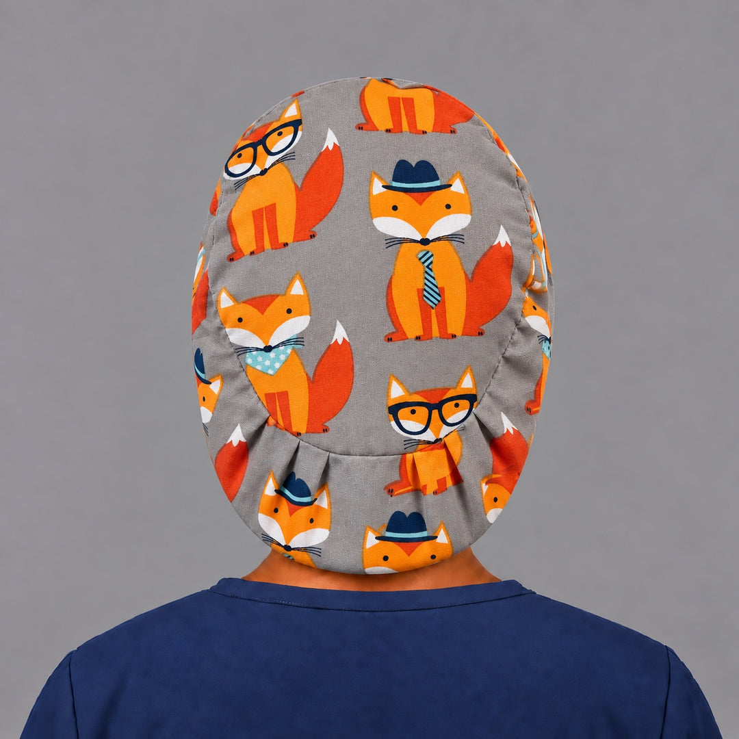 Back view of the fox Euro scrub cap — elastic gathered back showing hipster foxes across the grey crown