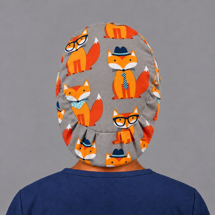 Back view of the fox Euro scrub cap — elastic gathered back showing hipster foxes across the grey crown