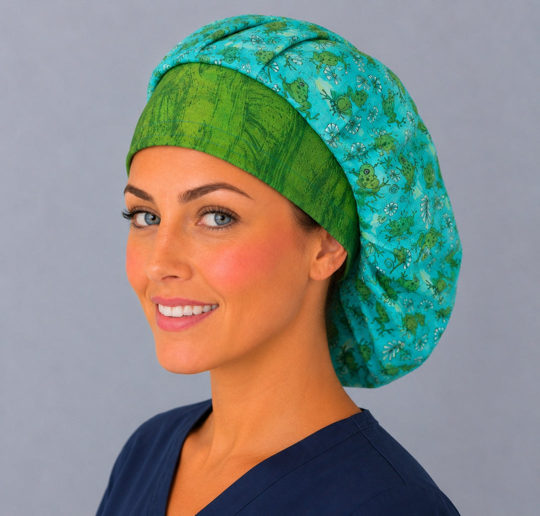 Three-quarter smiling view of the frog bouffant scrub cap for women — green frogs and wildflowers on teal, roomy handmade surgical bouffant hat