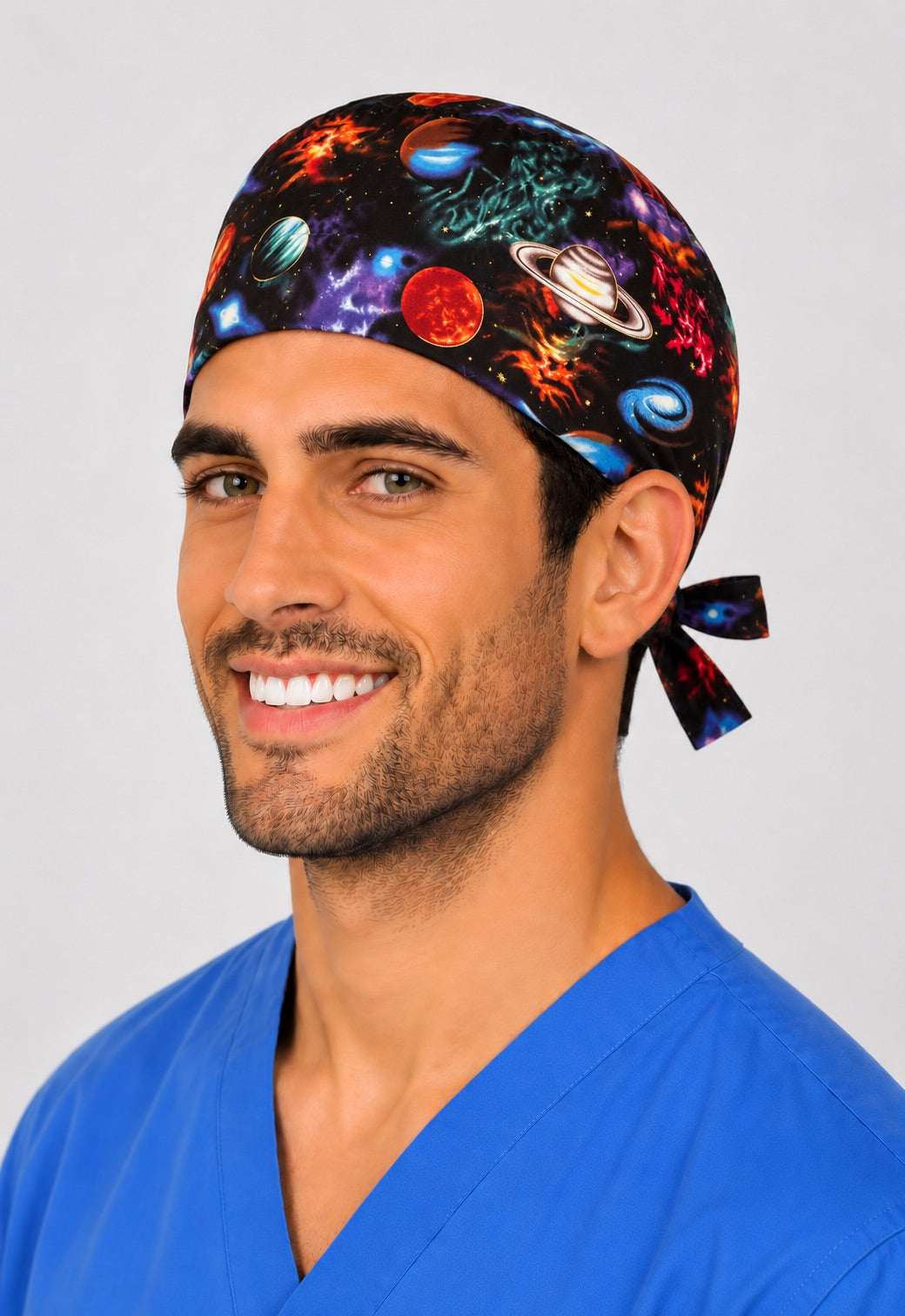 Man wearing galaxy planets scrub cap, angled front view — outer space print surgical hat for OR nurses and surgeons, handmade in USA by OR World