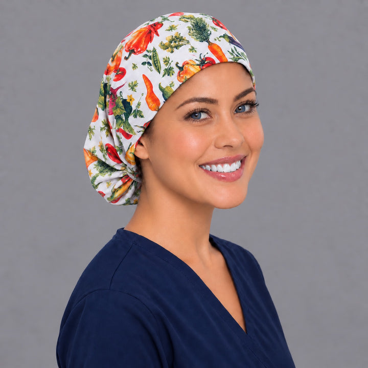 Garden veggie Euro scrub cap, right angled smiling view — colorful produce print for OR nurses and dietitians