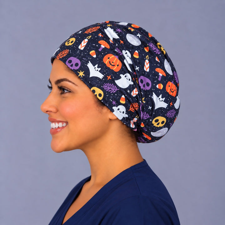 Ghost and pumpkin Euro surgical hat, left side profile — bats and moon print, breathable cotton cap for nurses