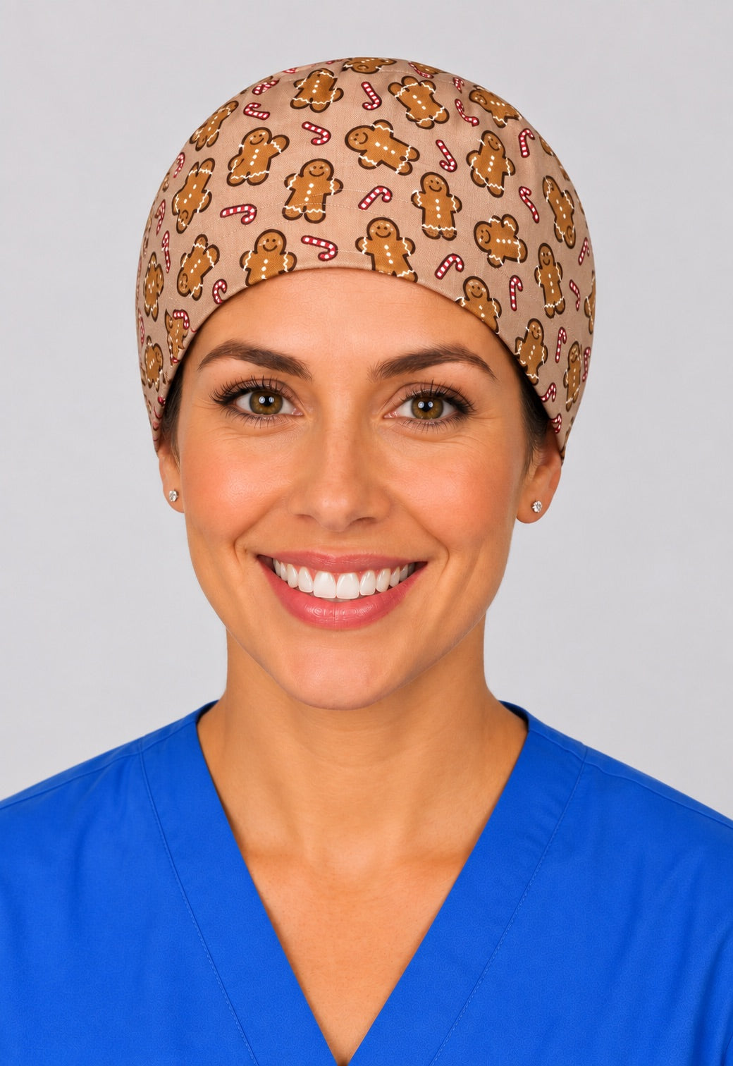 Gingerbread man and candy cane surgical hat in straight front view, holiday OR cap that fits short hair