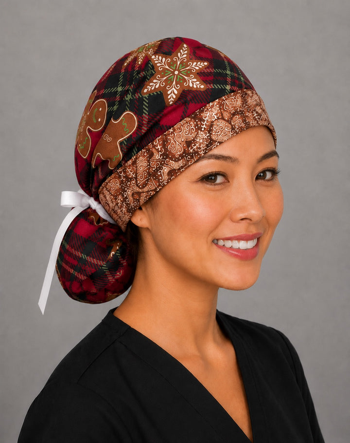 Gingerbread treats ponytail scrub cap left side profile showing gathered ponytail pouch of red plaid and gingerbread cookies with white ribbon tie
