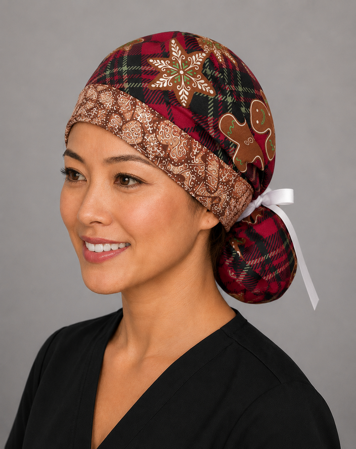 Gingerbread treats ponytail nurse cap left three-quarter angle on smiling model showing red plaid, gingerbread men and star cookies with gingerbread band and white ribbon bow