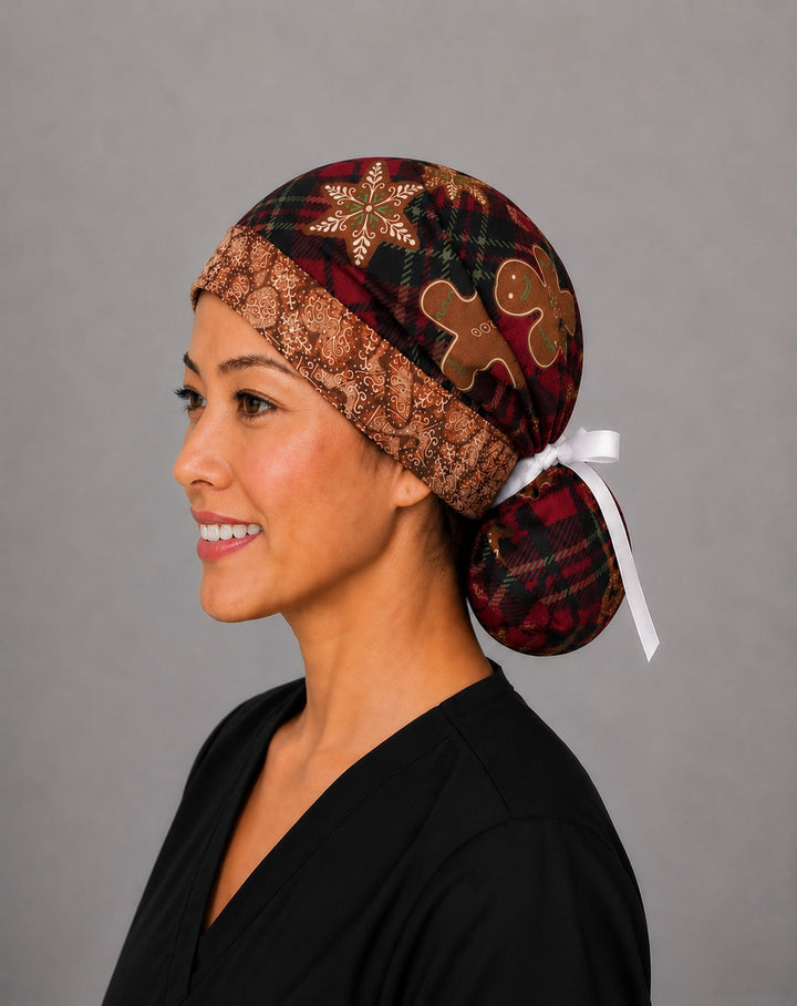 Gingerbread treats ponytail scrub cap right side profile with full ponytail pouch of red plaid and gingerbread cookies and long white ribbon ties