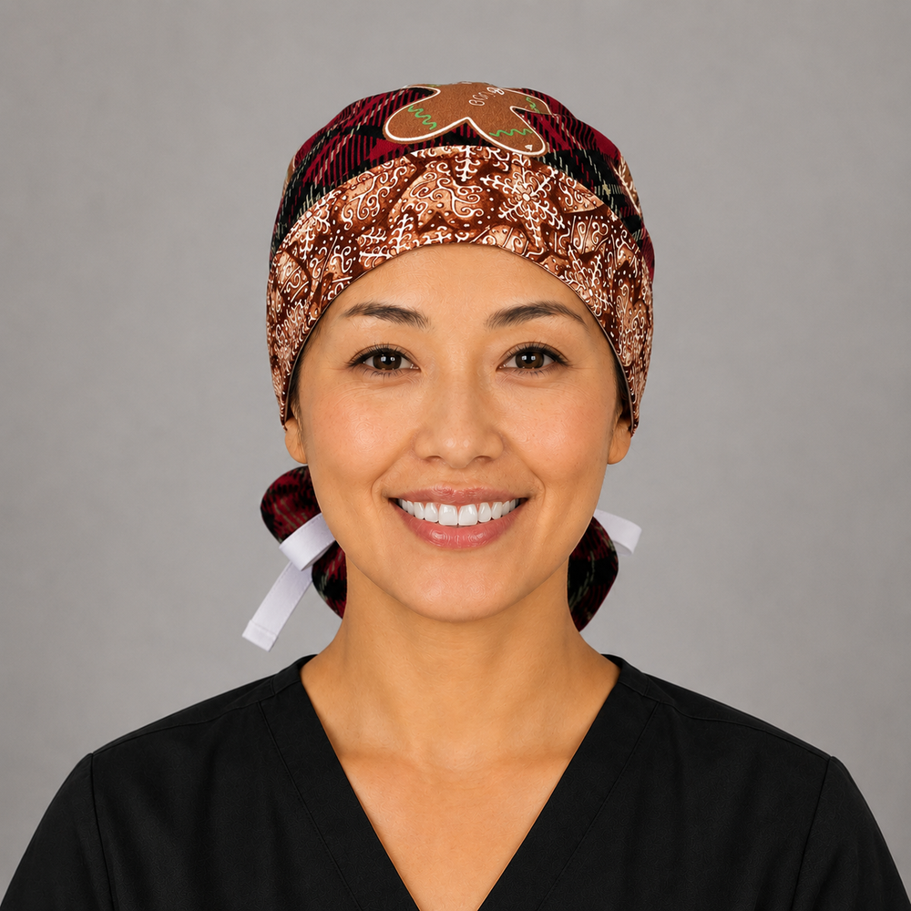 Gingerbread treats ponytail surgical cap right three-quarter angle showing red plaid, gingerbread men and star cookies with gingerbread band and white ribbon bow