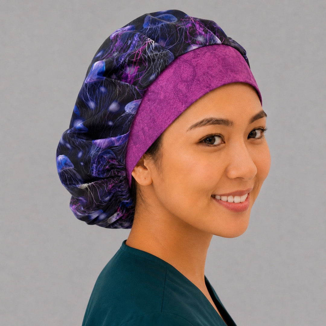 Profile view of the glowing sea life bouffant scrub cap — purple ocean jellyfish print, roomy cap that secures long thick hair for ocean-loving nurses