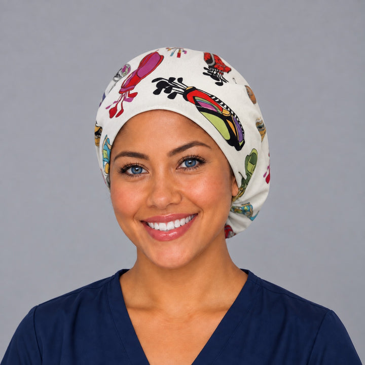 Woman wearing a golf bag and blossoms Euro scrub cap, front view — colorful golf bags on white, adjustable surgical hat for nurses