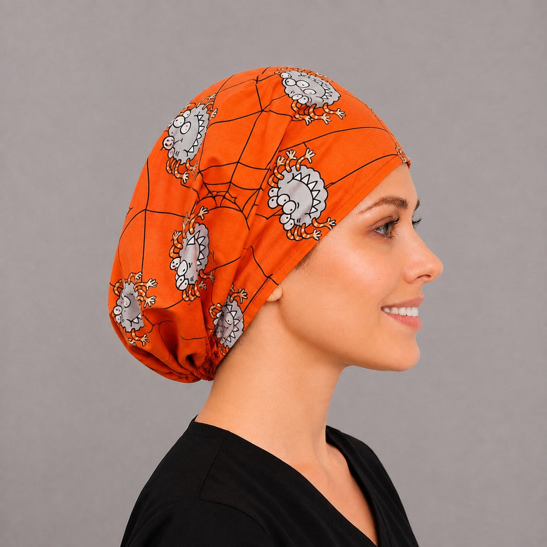 Back view of the googly spider Euro scrub cap — full coverage showing grinning spiders and webs across the orange crown