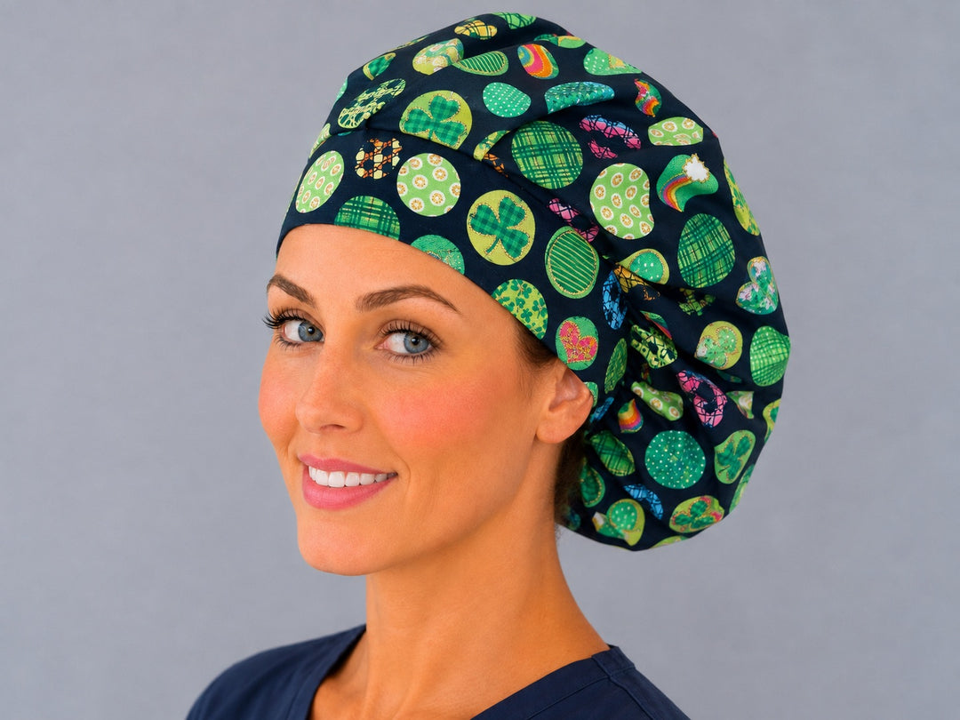 Green clover and rainbow bouffant scrub cap, left angled smiling view — festive navy print for OR nurses and surgical techs
