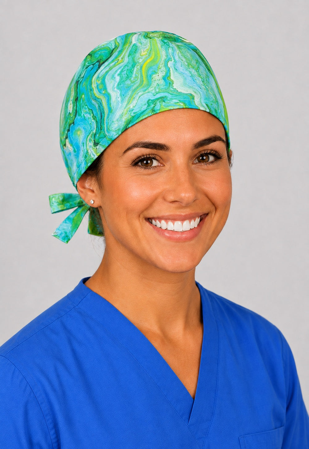 Green marble swirl scrub cap for short hair, handmade lime and teal tie-back surgical hat on OR nurse, front view