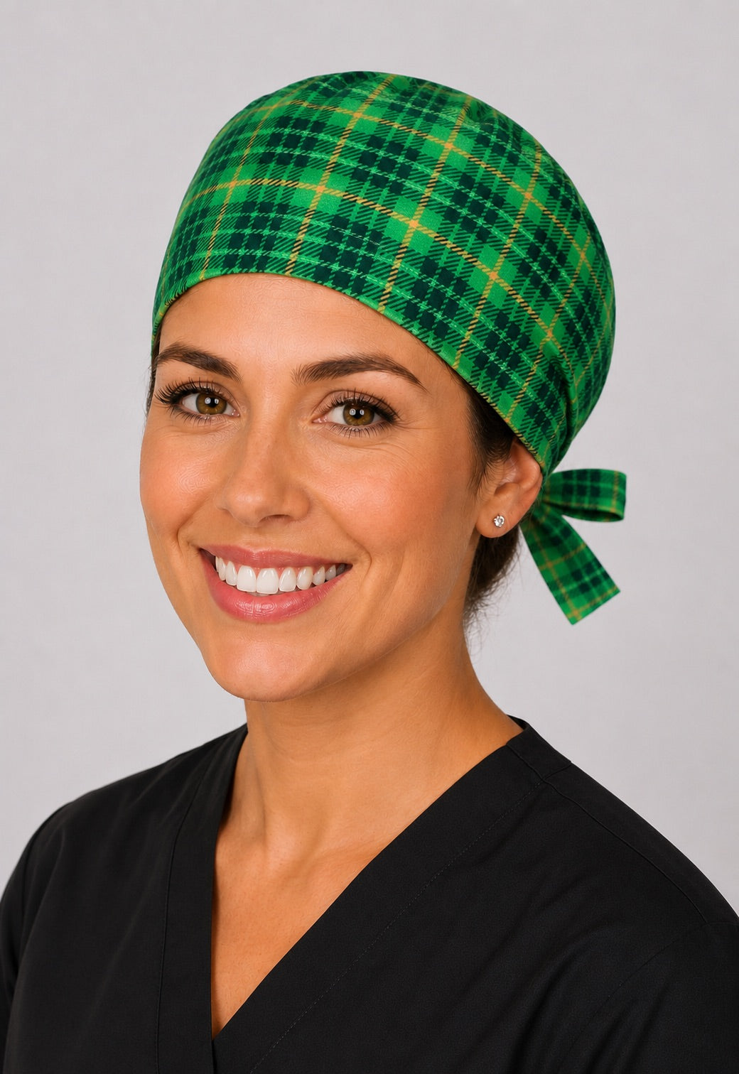 Green plaid St. Patrick's scrub cap for short hair, handmade Irish tartan tie-back surgical hat on OR nurse, front view
