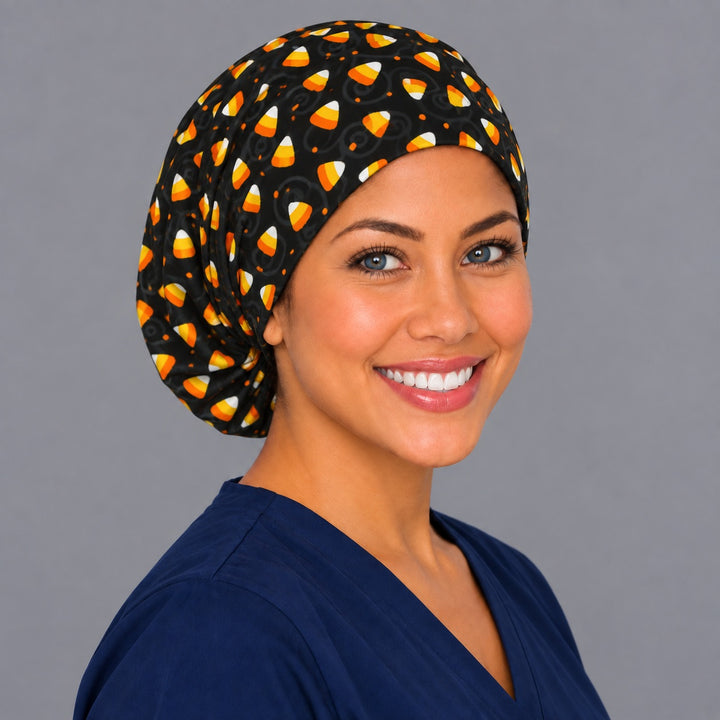 Halloween candy Euro scrub cap, right angled smiling view — classic candy corn print for OR nurses and surgical techs