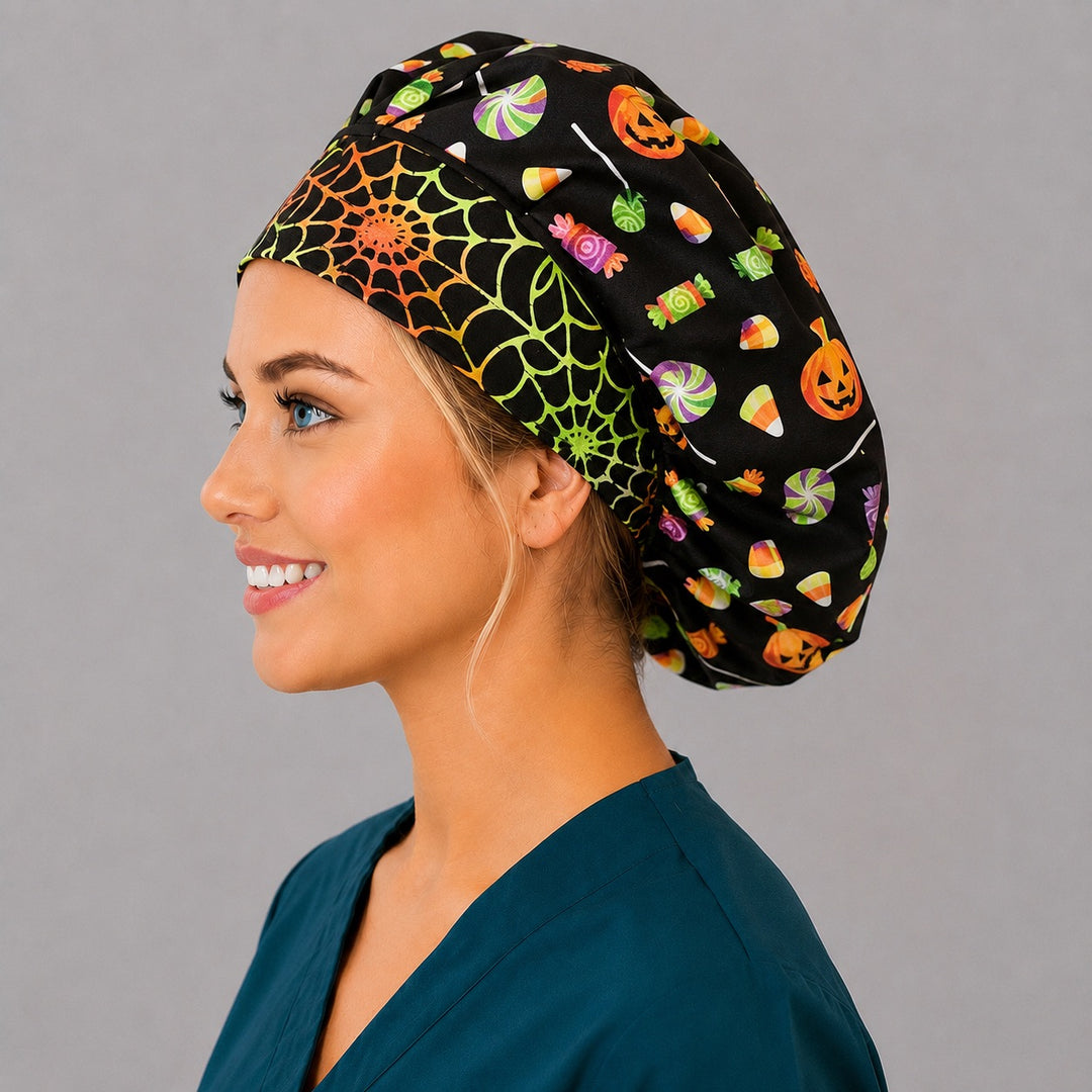 Halloween candy and pumpkin bouffant scrub cap left side profile showing rainbow spiderweb front band and candy pumpkin print on black, women&