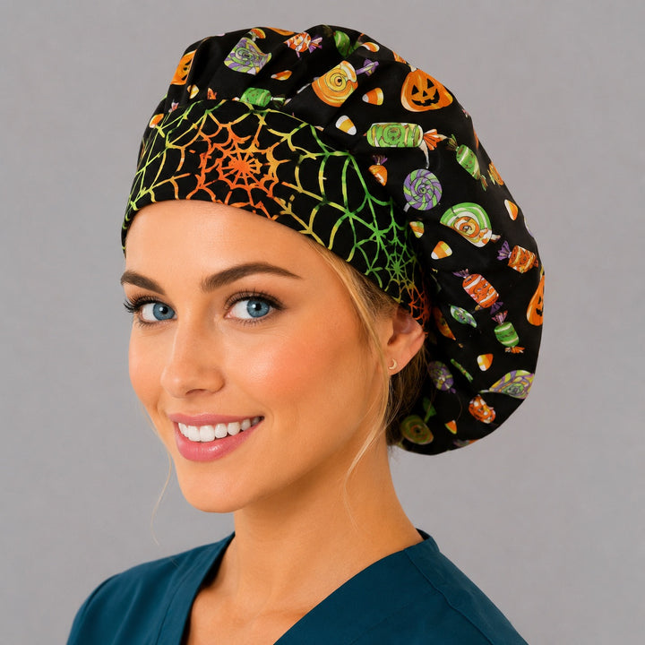 Halloween candy and pumpkin bouffant scrub cap left three-quarter angle on smiling model showing candy corn, pumpkins and rainbow spiderweb band, OR World nurse hat