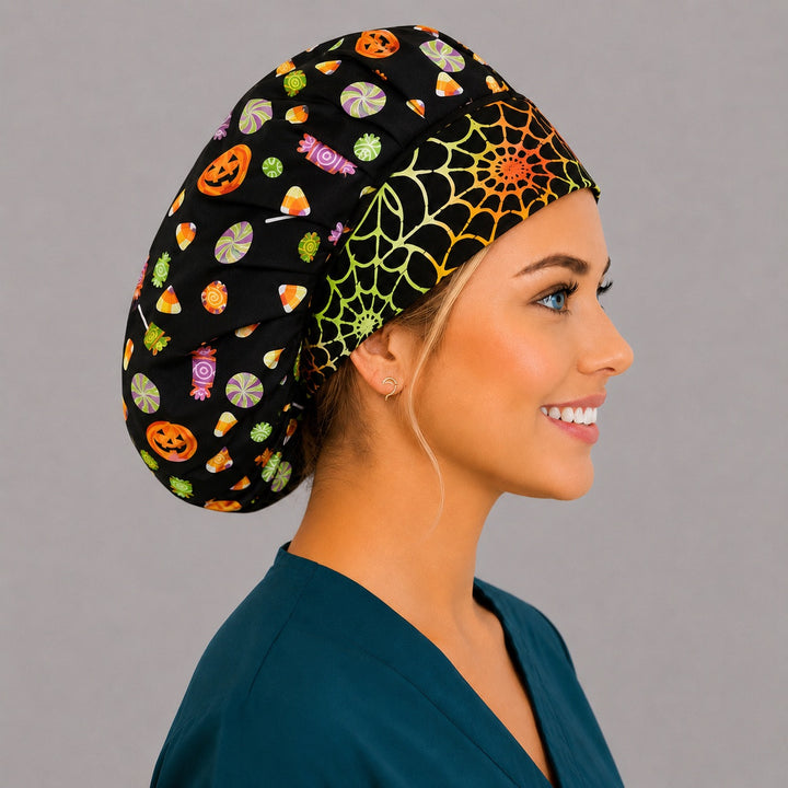 Halloween candy and pumpkin bouffant scrub cap right side profile showing candy corn, lollipops and rainbow spiderweb band on black, OR World nurse hat