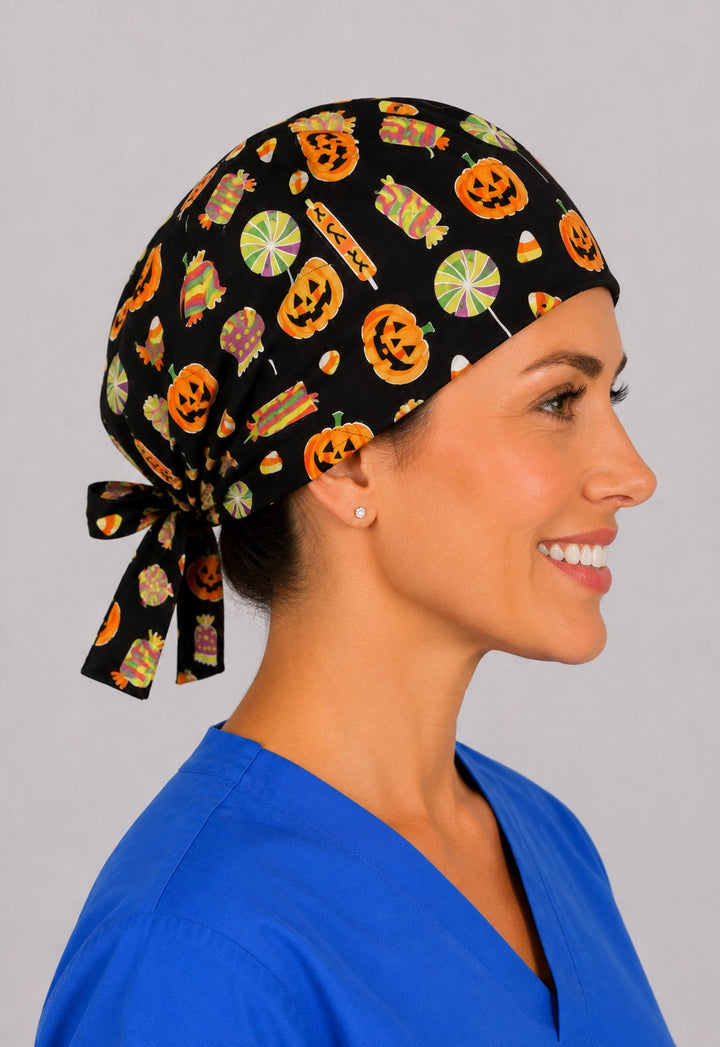 Right side view of Halloween candy and pumpkin scrub cap in black, handmade nurse hat