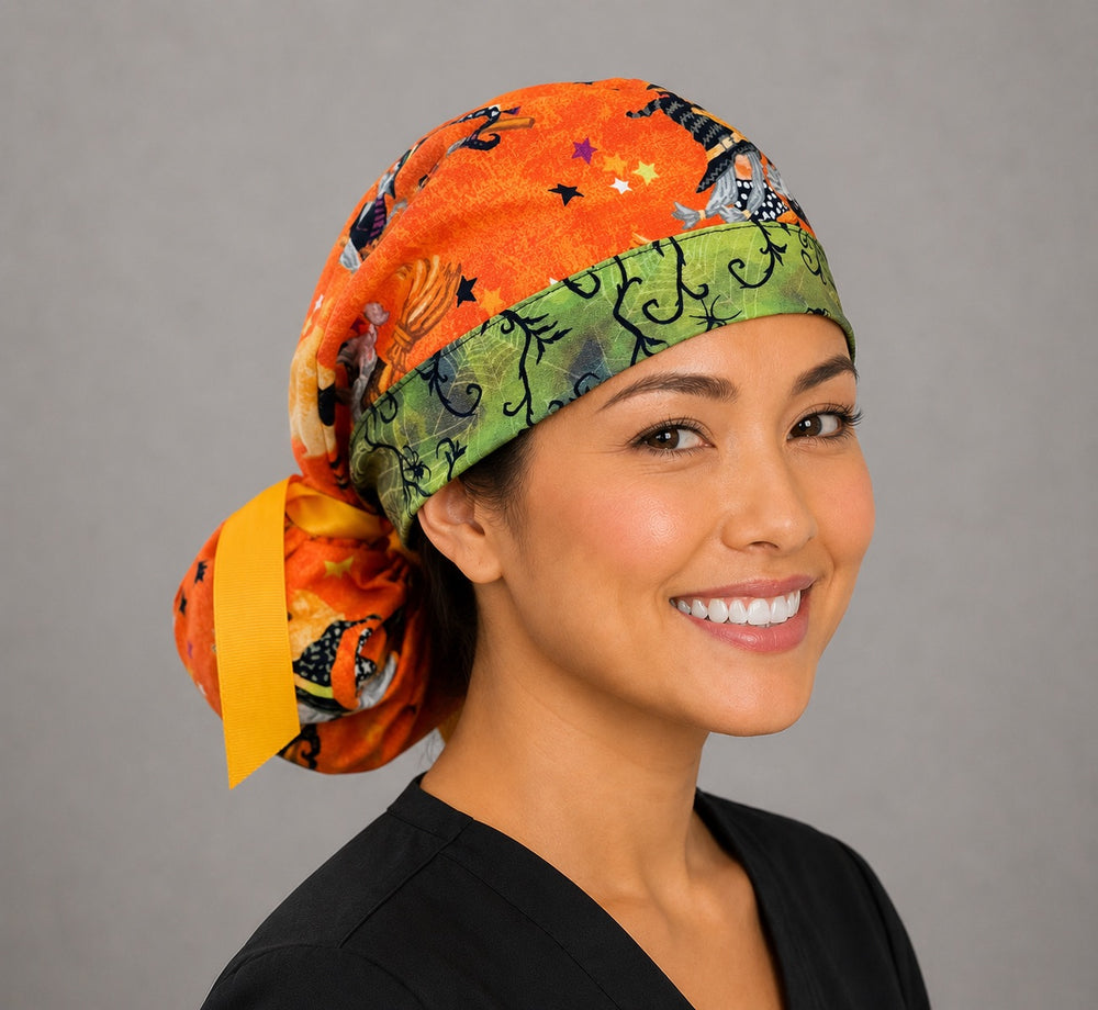 Halloween witch gnome ponytail scrub cap right side profile showing gathered ponytail pouch of witch gnomes, bats and stars on orange with purple band and yellow ribbon tie
