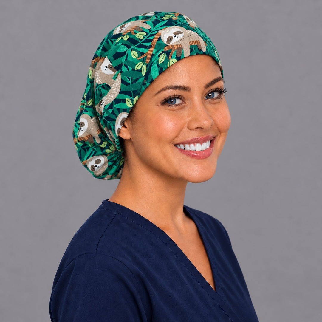 Hanging sloth Euro scrub cap, right angled smiling view — sleepy sloth print for OR nurses and vet techs