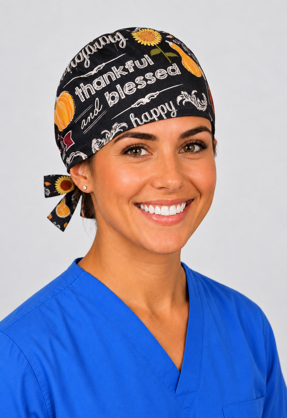 Rear knot on Happy Thanksgiving scrub hat showing pumpkin and autumn leaf print with adjustable ties