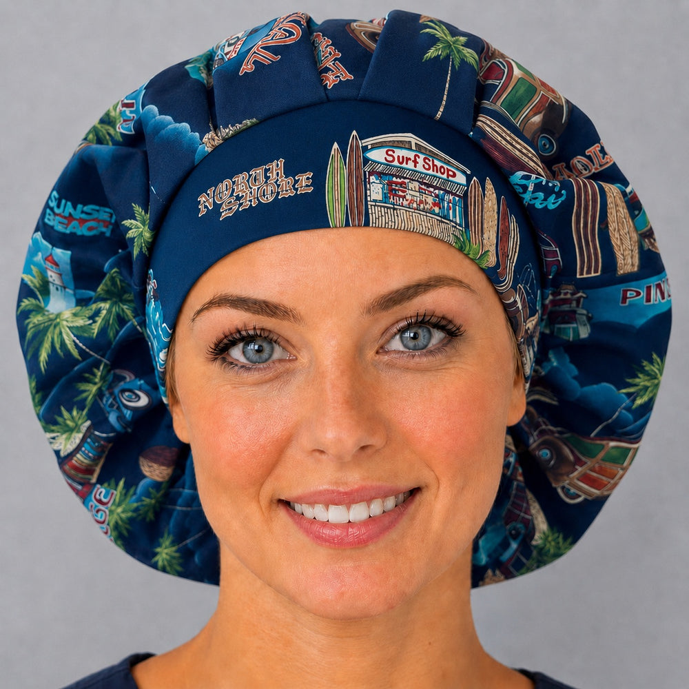 Woman wearing a Hawaii vacation bouffant scrub cap, front view — navy North Shore and surf shop print, adjustable women's surgical hat for long hair