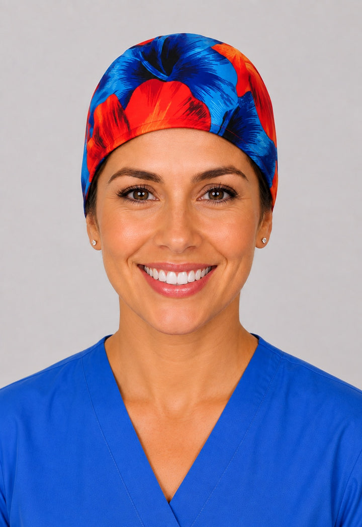 Hawaiian hibiscus scrub cap for short hair in blue and orange, handmade tropical tie-back surgical hat on OR nurse, front view