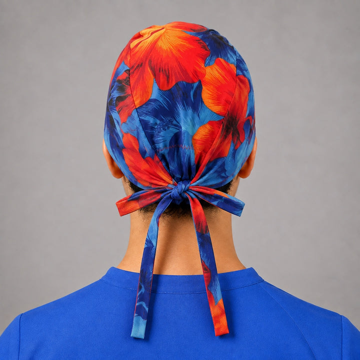 Back view of adjustable tie-back knot on blue and orange Hawaiian hibiscus tropical surgical hat