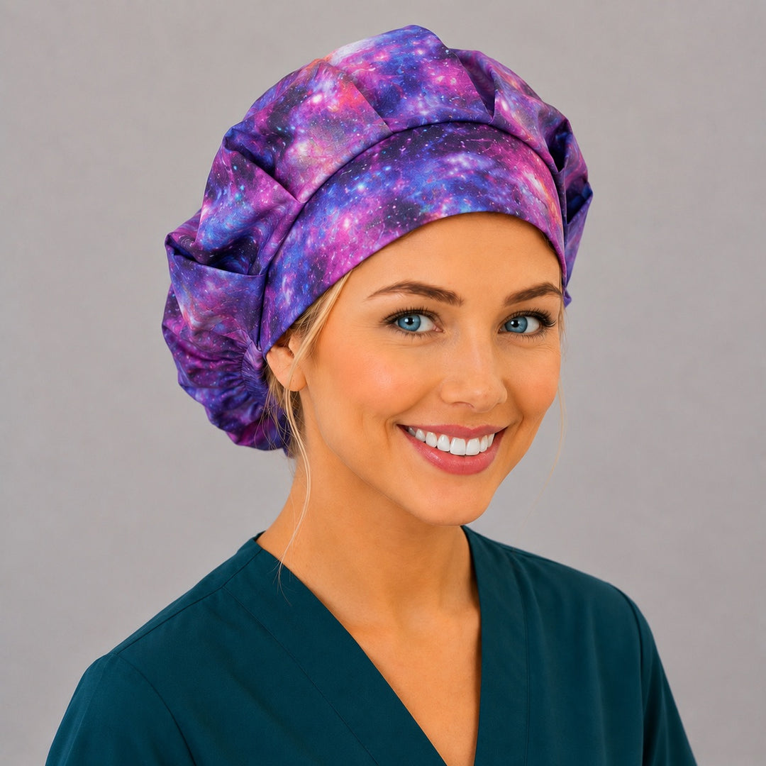 Healing Horizons galaxy bouffant scrub cap left three-quarter angle on smiling model showing purple and magenta nebula stars, women's celestial surgical hat OR World